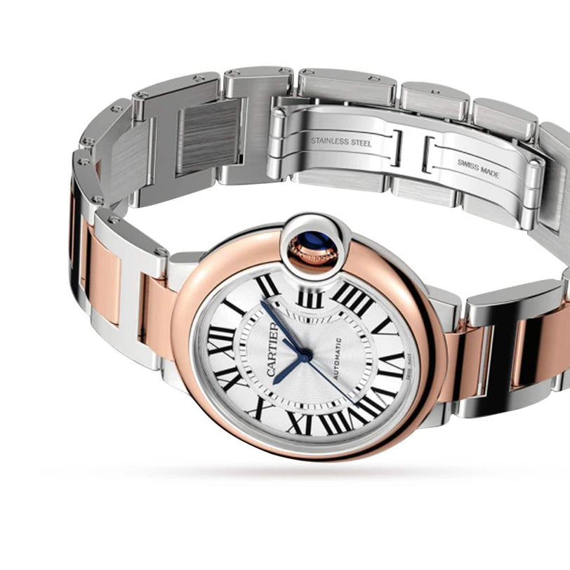 The Ballon Bleu de Cartier by Cartier is a luxurious two-tone silver and rose gold watch featuring a round face with Roman numeral hour markers and an interchangeable metal link bracelet, displayed against a white background.