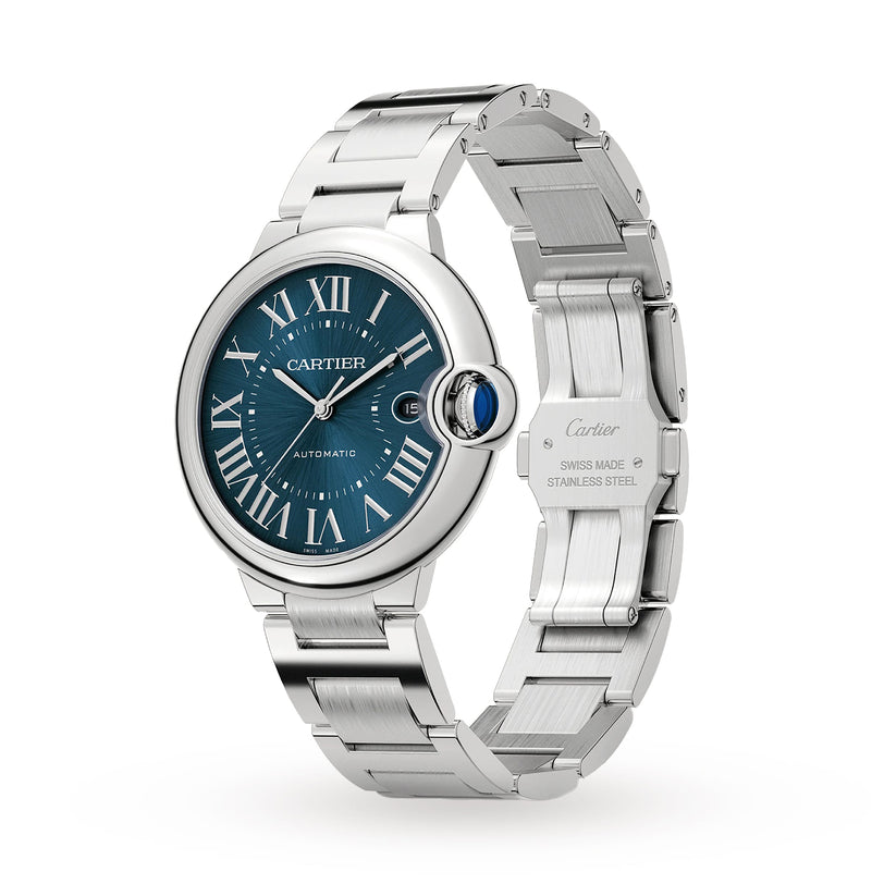 The Ballon Bleu de Cartier stainless steel watch features a blue Roman numeral dial, silver hands, date display, a sleek steel bracelet, and automatic movement, shown at an angle on a white background.