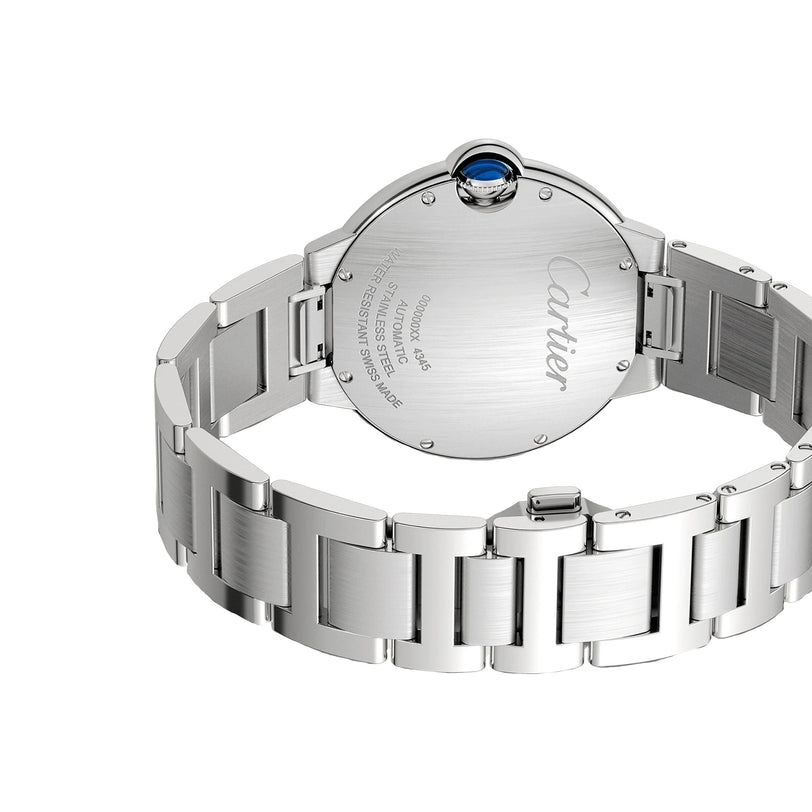 The back of the Ballon Bleu de Cartier watch in silver shows its automatic movement, engraved brand and product details on the case, plus a steel bracelet and blue crown.