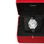 The Ballon Bleu de Cartier watch by Cartier features a black alligator leather strap, Roman numeral dial, and mechanical movement. Shown in an open red Cartier box with a black interior.