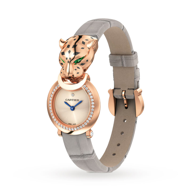 The La Panthère de Cartier by Cartier is a rose gold wristwatch with a diamond bezel, alligator leather strap, and a sculpted panther head with green eyes on the case, adorned with brilliant-cut diamonds.