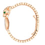 The La Panthère de Cartier by Cartier is a rose gold bracelet watch featuring a panther head adorned with green gemstone eyes and black spots.