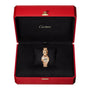 The La Panthère de Cartier gold watch by Cartier, featuring a panther design, is displayed in an open red and black Cartier box.