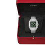 A Cartier Santos de Cartier silver wristwatch with a green dial and self-winding mechanical movement is shown in an open red Cartier box with a black interior.