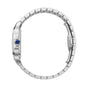 Side view of a silver Cartier Santos de Cartier wristwatch with a blue crown and linked bracelet, highlighting its self-winding mechanical movement against a white background.