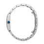The Cartier Tank Française is a thin silver oval bracelet featuring a single blue gemstone on one side.