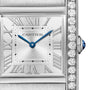 A close-up of the Cartier Tank Française reveals its Roman numerals, blue steel hands, diamond-set bezel, and signature cabochon crown—a timeless icon from Cartier.