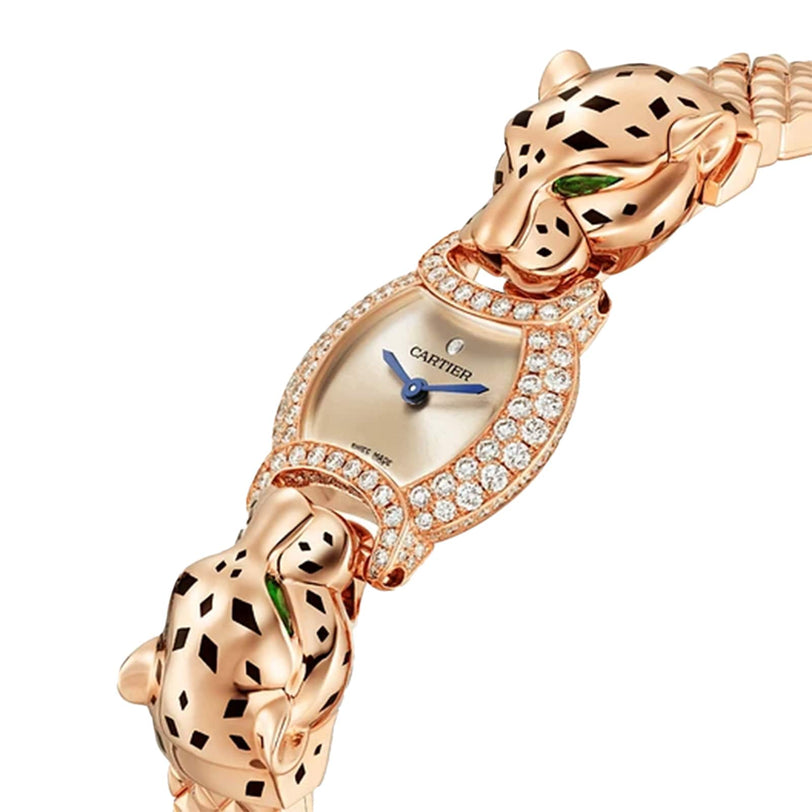 The La Panthère de Cartier watch by Cartier features two panther head details, diamond accents, an oval face with blue hands, and a silver dial.