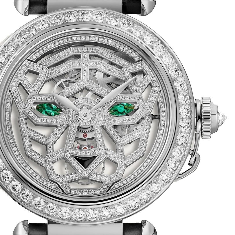 The Panthère Jewelry by Cartier features a luxury watch face with a diamond-encrusted geometric panther design, green gemstone eyes, and striking skeletonized inner mechanisms.