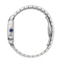 Side view of a Cartier Santos de Cartier silver metal wristwatch featuring a linked bracelet, automatic movement, and a blue gemstone set in the crown.