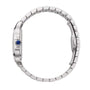 Side view of the Santos de Cartier wristwatch by Cartier, featuring a silver metal case, automatic winding, blue gemstone crown, and a minimalist link bracelet.