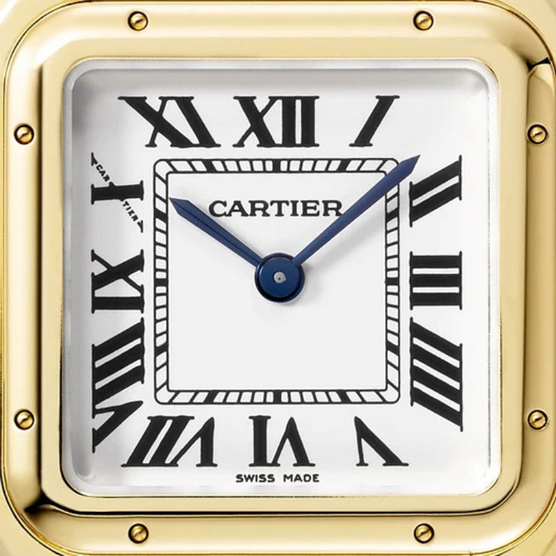 Close-up of the Panthère de Cartier Small Model watch face by Cartier, featuring Roman numerals, blue hands, a yellow gold frame, and a blue sapphire set on the crown; the time displayed is about 1:53.