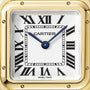 Close-up of the Panthère de Cartier Small Model watch face by Cartier, featuring Roman numerals, blue hands, a yellow gold frame, and a blue sapphire set on the crown; the time displayed is about 1:53.