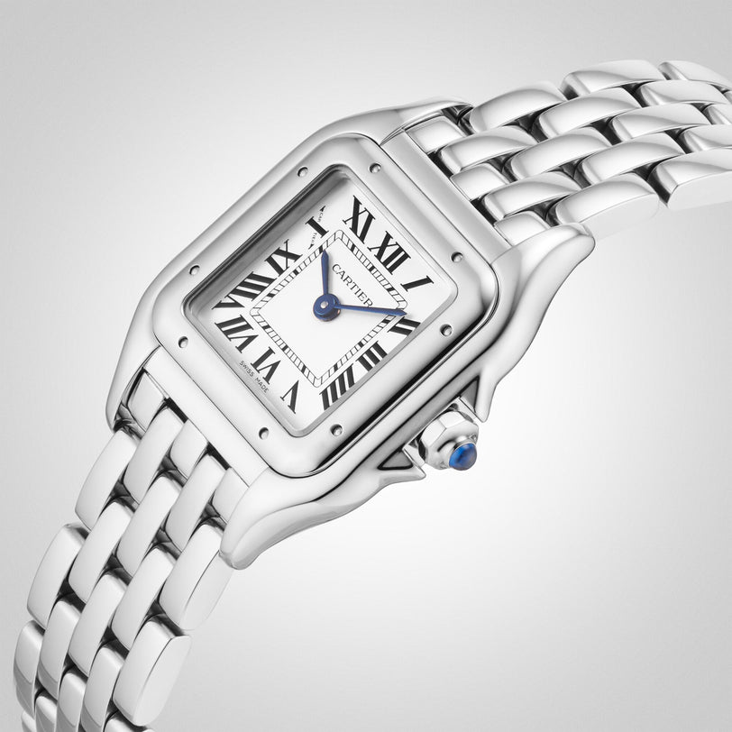 The Cartier Panthère de Cartier Small Model features a square silver face, Roman numerals, blue steel hands, and a linked metal band—a timeless style icon.