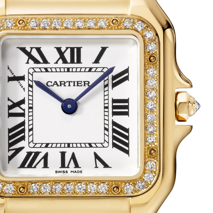 Close-up of the Panthère de Cartier by Cartier, featuring an 18K yellow gold case, diamond bezel, Roman numeral dial, blue hands, and a Swiss Made label.