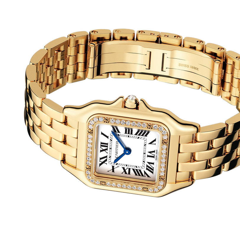 The Panthère de Cartier by Cartier is an 18K yellow gold jewellery watch with a square face, Roman numerals, blue hands, a diamond-encrusted bezel, and a luxurious gold link bracelet.