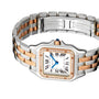 The Panthère de Cartier watch by Cartier features a two-tone design with a square face, Roman numerals, blue hands, 18K rose gold accents, diamond-set bezel, and a stainless steel and rose gold bracelet.