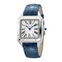 The Cartier Santos-Dumont watch features a square silver case, Roman numeral hour markers, blue hands, and a blue leather strap.
