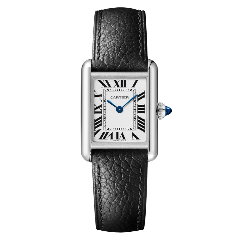 The Cartier Tank Must Solarbeat™ is a rectangular wristwatch with a silvered dial, black Roman numerals, blue hands, and a black leather strap, powered by the SolarBeat™ photovoltaic movement.