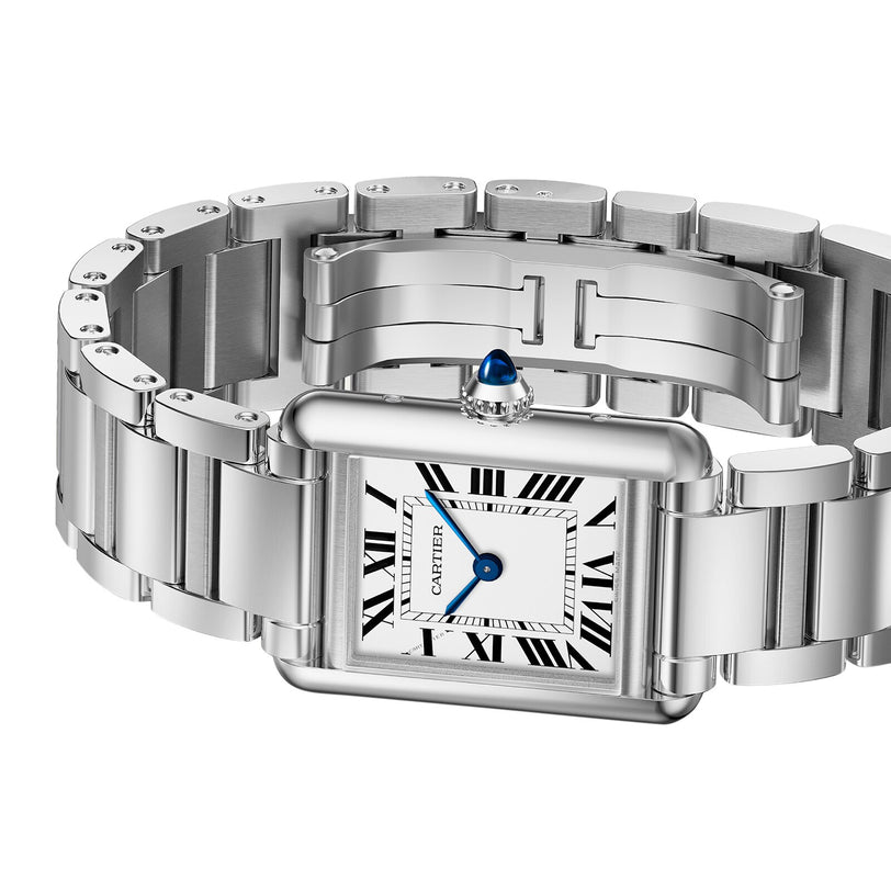 The Cartier Tank Must Solarbeat™ features a stainless steel rectangular case, Roman numeral hour markers, blue sword-shaped hands, and a linked metal bracelet.