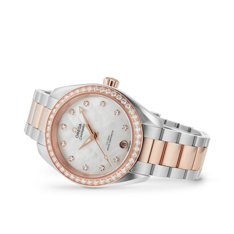 The OMEGA Seamaster Aqua Terra 150M features a silver and rose gold metal band, diamond bezel, white mother-of-pearl dial with diamond hour markers, 8800 calibre movement, and a date window at 6 o’clock.