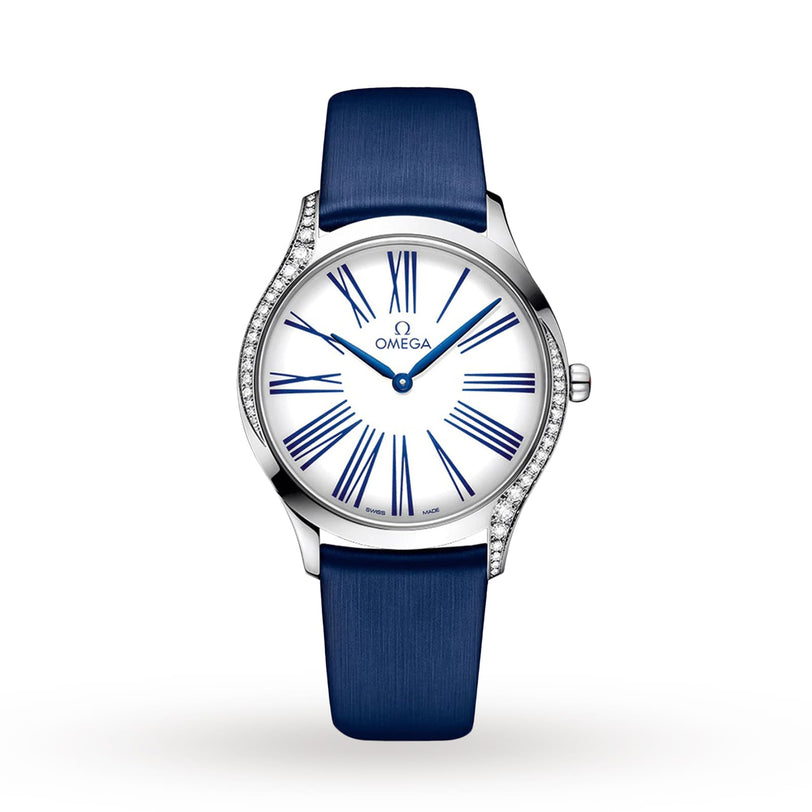 OMEGA De Ville Tresor 36 ladies’ watch with a blue leather strap, white dial featuring blue Roman numerals, and a steel bezel set with elegant diamonds on one side.
