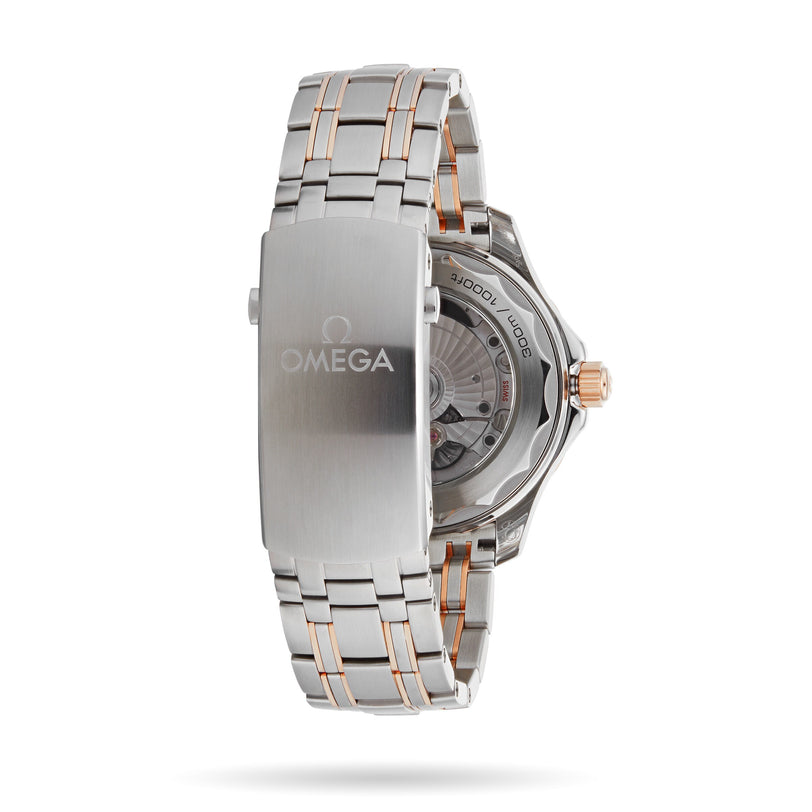 An OMEGA Seamaster Diver 300M wristwatch in stainless steel and rose gold, featuring a clasp with the Omega logo and a partial view of its transparent case back and movement.