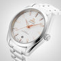 OMEGA Seamaster Aqua Terra 150M wristwatch with a white patterned dial, rose gold markers and hands, and a metal bracelet, displayed at an angle.