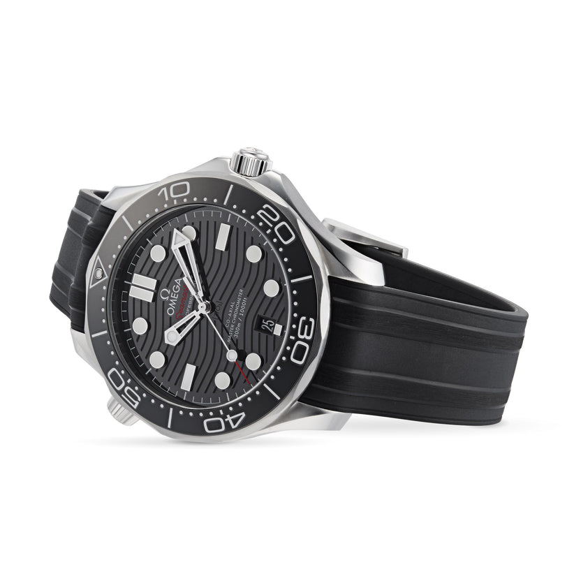 A black OMEGA Seamaster Diver 300M with a black rubber strap, black wave-pattern dial, and unidirectional rotating bezel, shown at an angle.