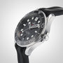 A close-up of the OMEGA Seamaster Diver 300M, featuring a black dial with wave pattern, bold hour markers, and a black rubber strap set against a light background.