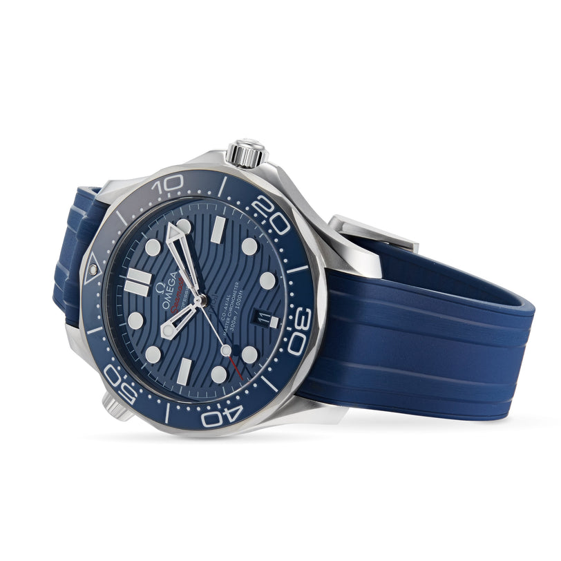 OMEGA Seamaster Diver 300M with a blue wavy-patterned dial, white hour markers, and a blue rubber strap featuring the precise OMEGA Calibre 8800 movement, shown angled.