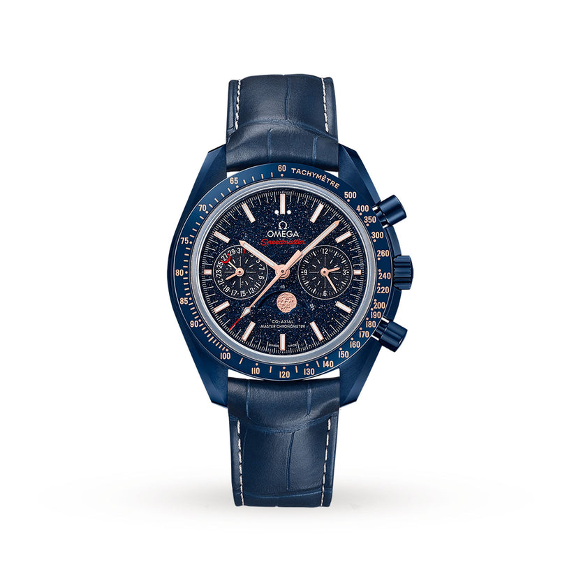 The OMEGA Speedmaster 44 Ceramic wristwatch features a textured dark blue dial, rose gold-tone markers, three subdials, Moonphase indicator, tachymeter bezel, and a blue leather strap against a white background.