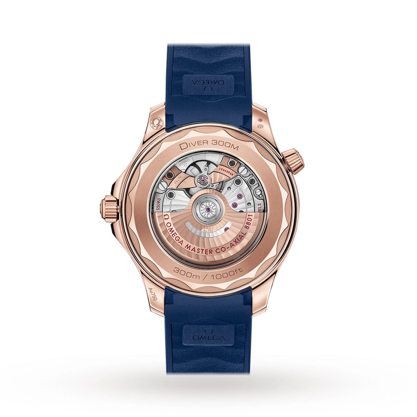 Back view of the OMEGA Seamaster Diver 300M, highlighting its exposed mechanical movement, rose gold case, and blue rubber strap—a stylish dive watch choice.