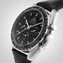 Close-up of the OMEGA Speedmaster Moonwatch Professional with black dial, three subdials, tachymeter bezel, and black leather strap, powered by the calibre 3861 Master Chronometer movement.