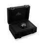 An OMEGA Speedmaster Moonwatch Professional wristwatch is shown in an open black presentation box with the OMEGA logo and “Speedmaster” on the inner lid, highlighting its exceptional 3861 calibre movement.