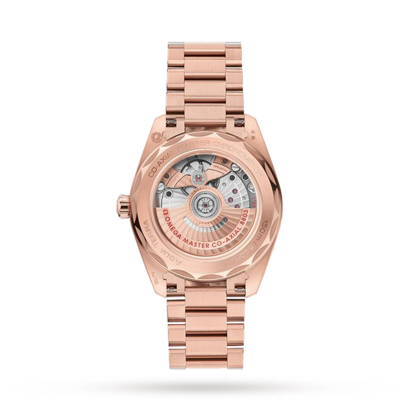 Rear view of the OMEGA Seamaster Aqua Terra 150M in 18K Sedna gold, highlighting its exposed automatic Co-Axial Master Chronometer calibre 8803 and engraved case details.