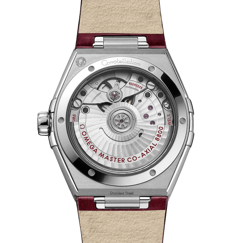 Close-up of the back of an OMEGA Constellation, revealing the Master Chronometer certified 8800 calibre movement with “OMEGA Master Co-Axial 8800” text in a stainless steel case.