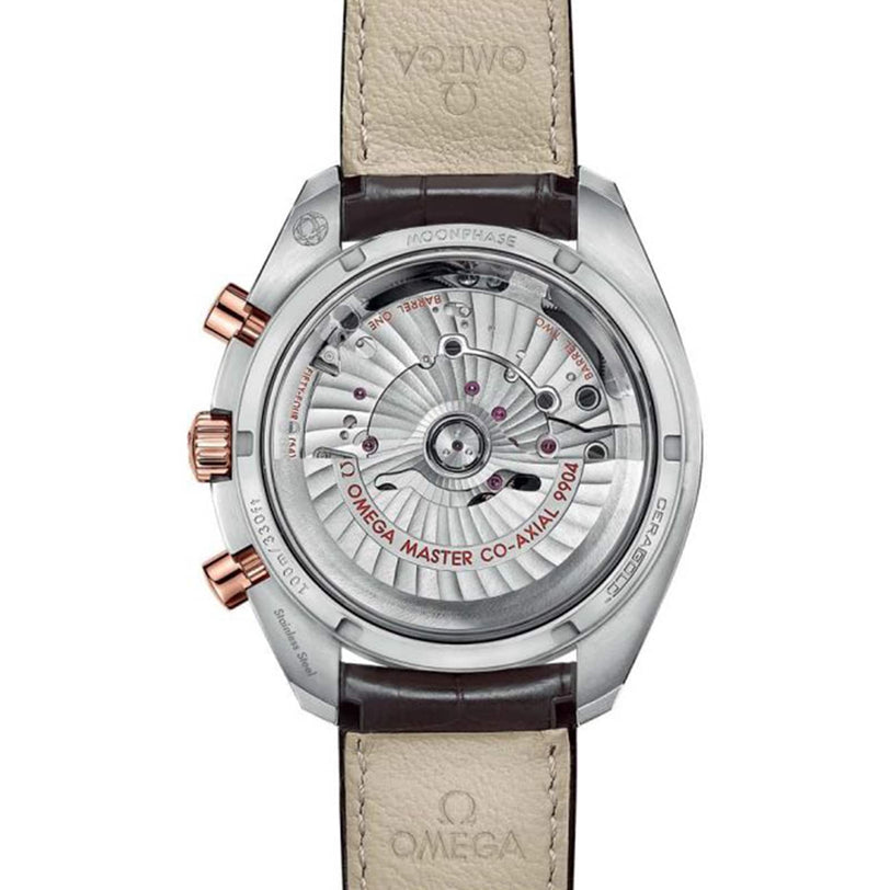 Back view of the OMEGA Speedmaster Moonwatch Co-Axial Chronograph, featuring a 42.5 mm stainless steel and 18K Sedna™ gold case, exposed movement with visible gears, and finished with a brown leather strap.