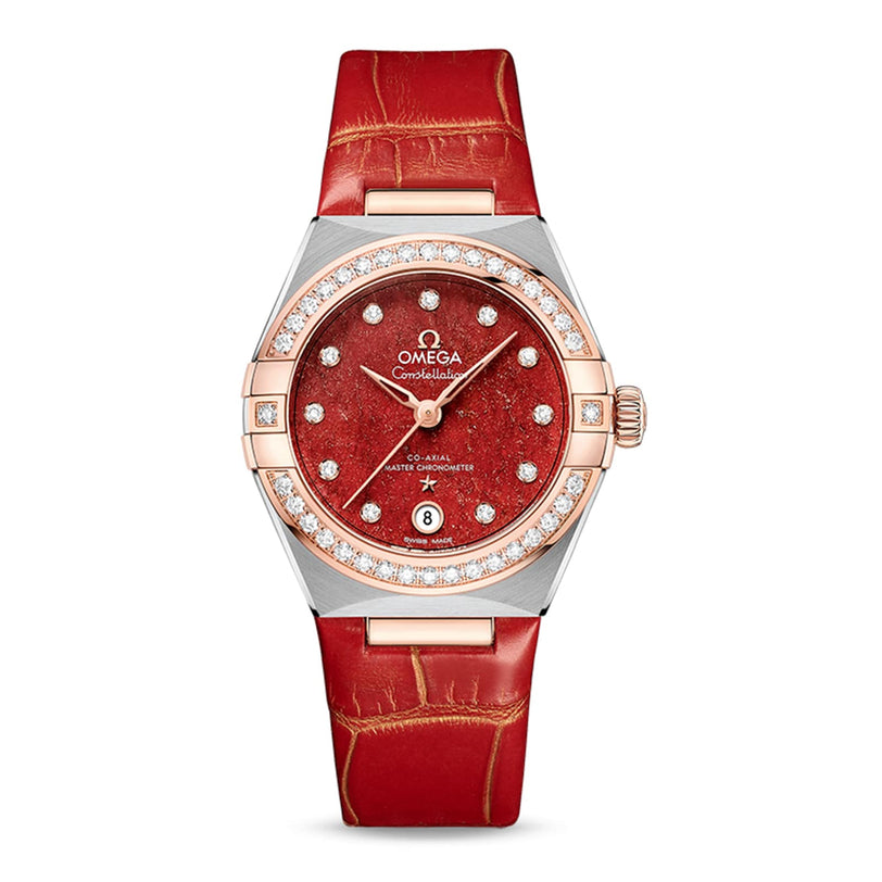 The OMEGA Constellation features a red leather strap, diamond-set bezel, and a red textured dial with date at 6 o’clock, powered by the Master Chronometer 8700 calibre movement.