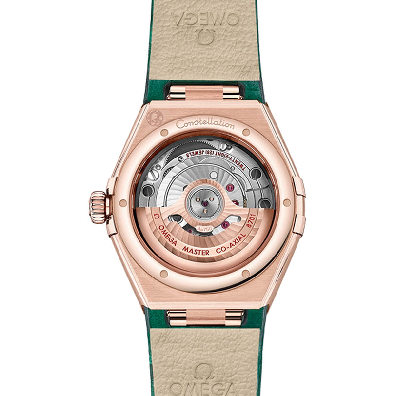 Close-up of the back of the OMEGA Constellation, featuring its visible automatic movement through a transparent case back and a leather strap with green accents.