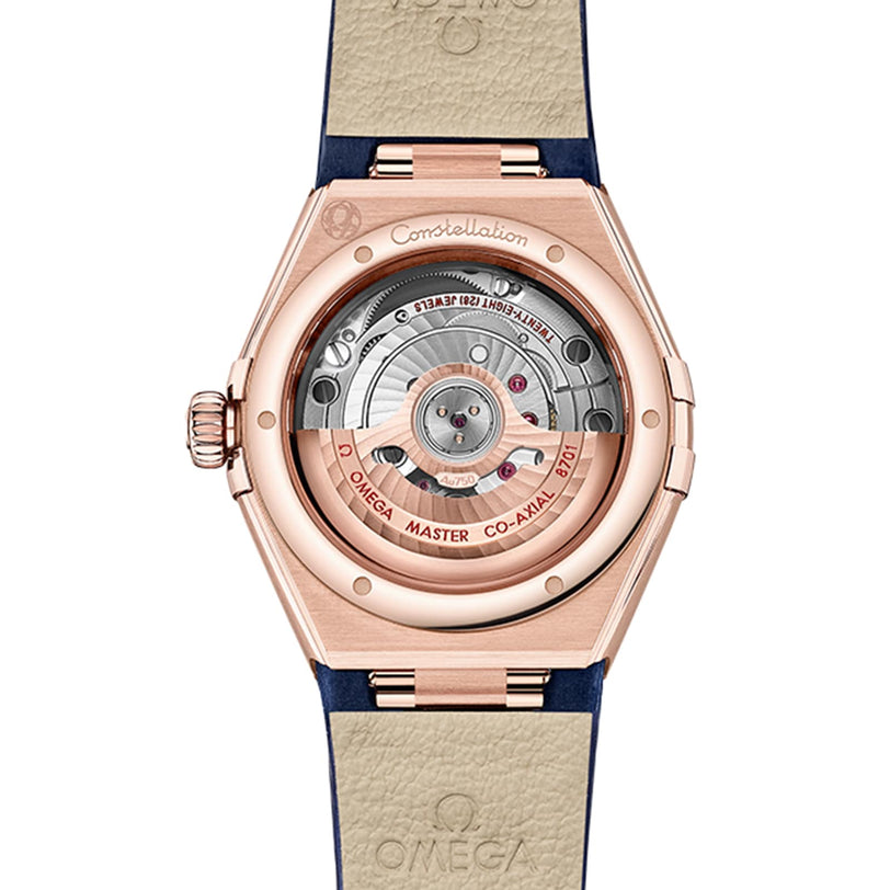 The image shows the caseback of the OMEGA Constellation, revealing its mechanical movement through a transparent sapphire crystal back.