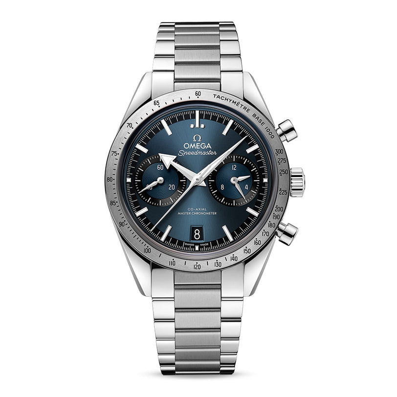 The OMEGA Speedmaster 57 is a stainless steel wristwatch with a blue dial, three subdials, date window, tachymeter bezel, calibre 9906 movement, and a metal bracelet.