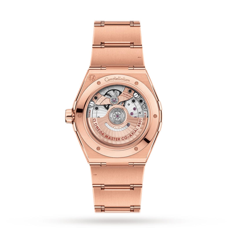 An OMEGA Constellation wristwatch in 18K Sedna™ gold with a visible mechanical movement and “Co-Axial Master Chronometer Calibre 8801” displayed on the caseback.