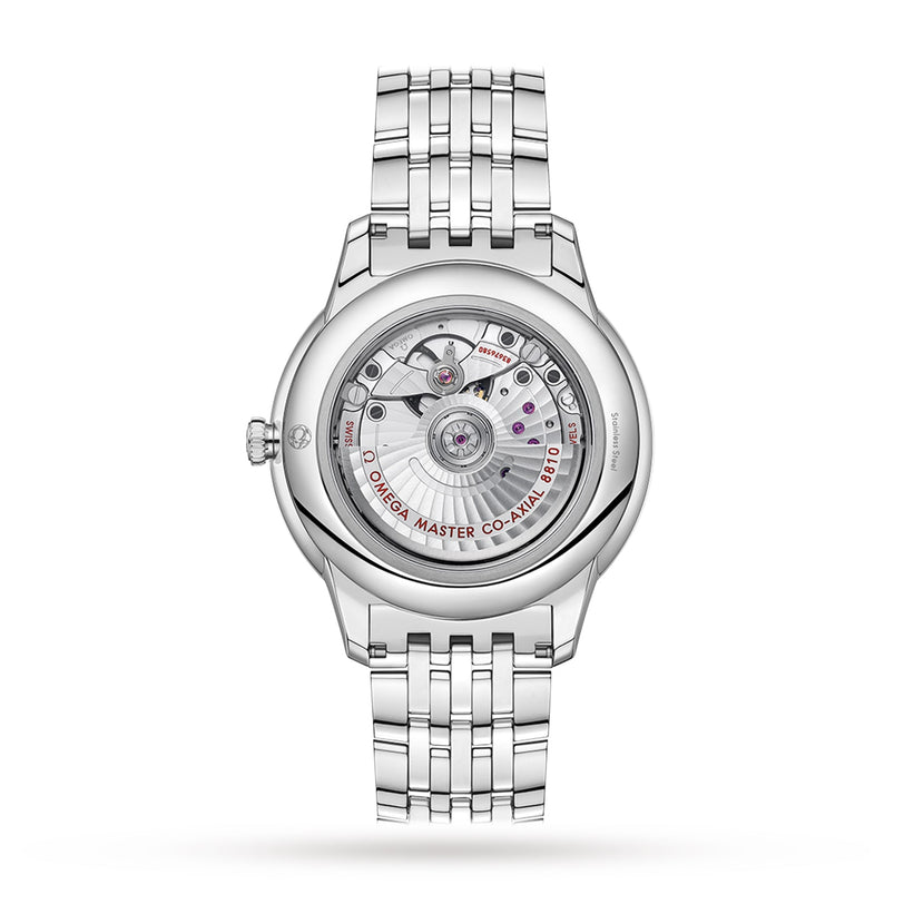 The back view of the silver OMEGA De Ville Prestige wristwatch displays its elegant design through a transparent case back, revealing intricate movement details and engraved lettering.