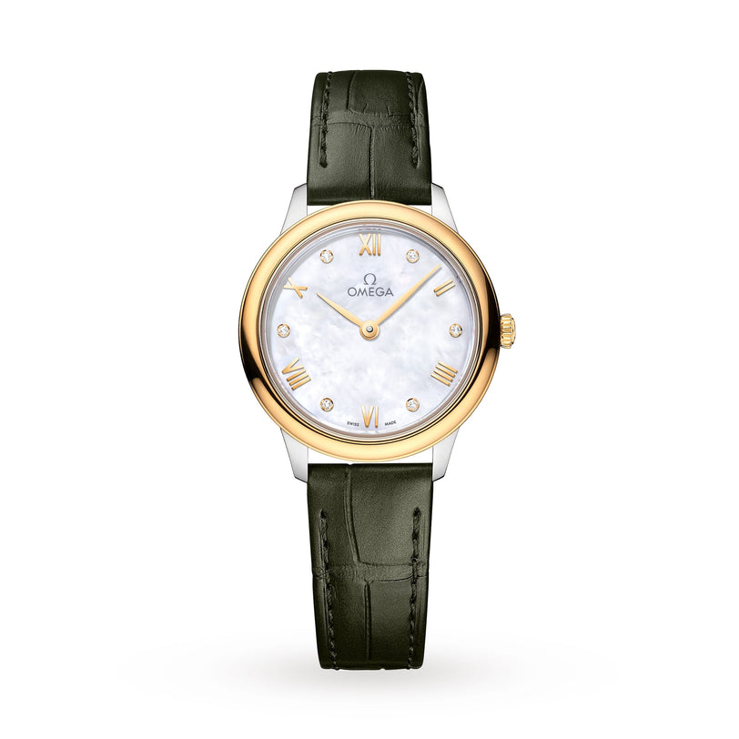 The OMEGA De Ville Prestige wristwatch features a white mother-of-pearl dial, stainless steel and 18K yellow gold bezel, Roman numeral and diamond hour markers, green leather strap, and Quartz Calibre 4061 on a white background.