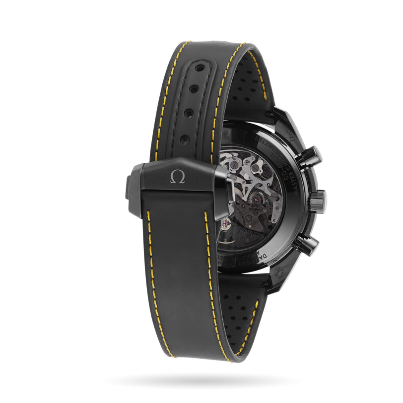 Rear view of the OMEGA Speedmaster Moonwatch Apollo 8 Dark Side Of The Moon, featuring a black perforated rubber strap with yellow stitching and a transparent case back revealing its movement, inspired by the Apollo 8 mission.