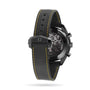 Rear view of the OMEGA Speedmaster Moonwatch Apollo 8 Dark Side Of The Moon, featuring a black perforated rubber strap with yellow stitching and a transparent case back revealing its movement, inspired by the Apollo 8 mission.