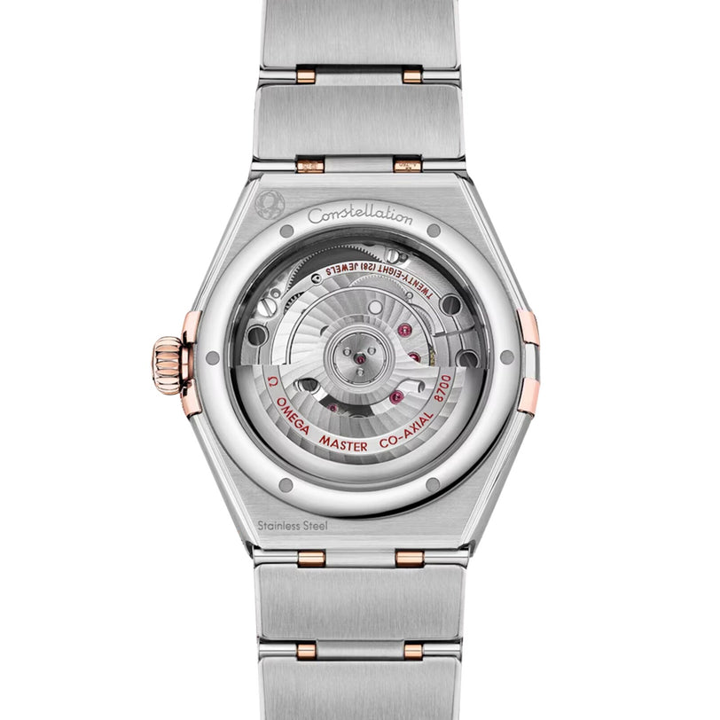 Back view of the OMEGA Constellation watch featuring a stainless steel case, diamond-paved bezel, and a transparent caseback revealing its mechanical movement.