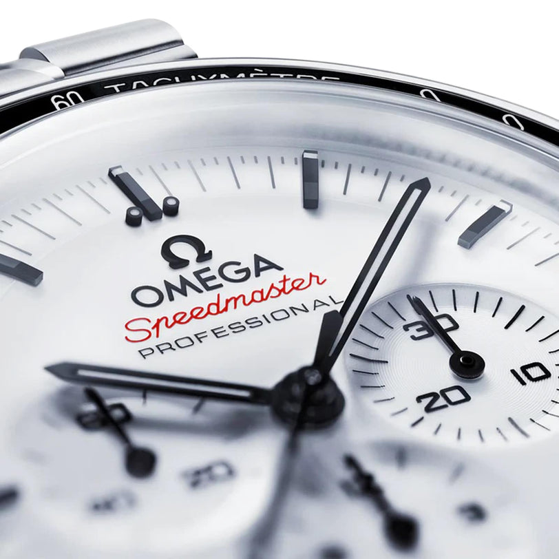 Close-up of the OMEGA Speedmaster Moonwatch Professional watch face with black hands, subdials, red Speedmaster logo, and powered by the advanced OMEGA 3861 calibre.