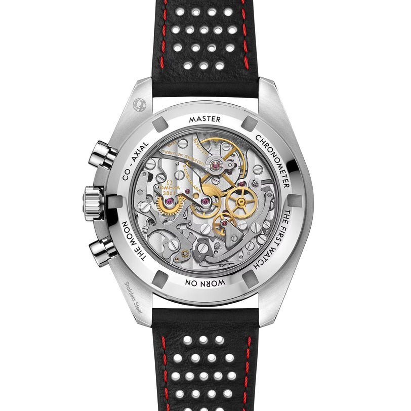 The back of the OMEGA Speedmaster Moonwatch Professional showcases its Co-Axial Master Chronometer movement, engraved with “Master Chronometer” and “The First Watch Worn on the Moon,” and features a perforated black strap.